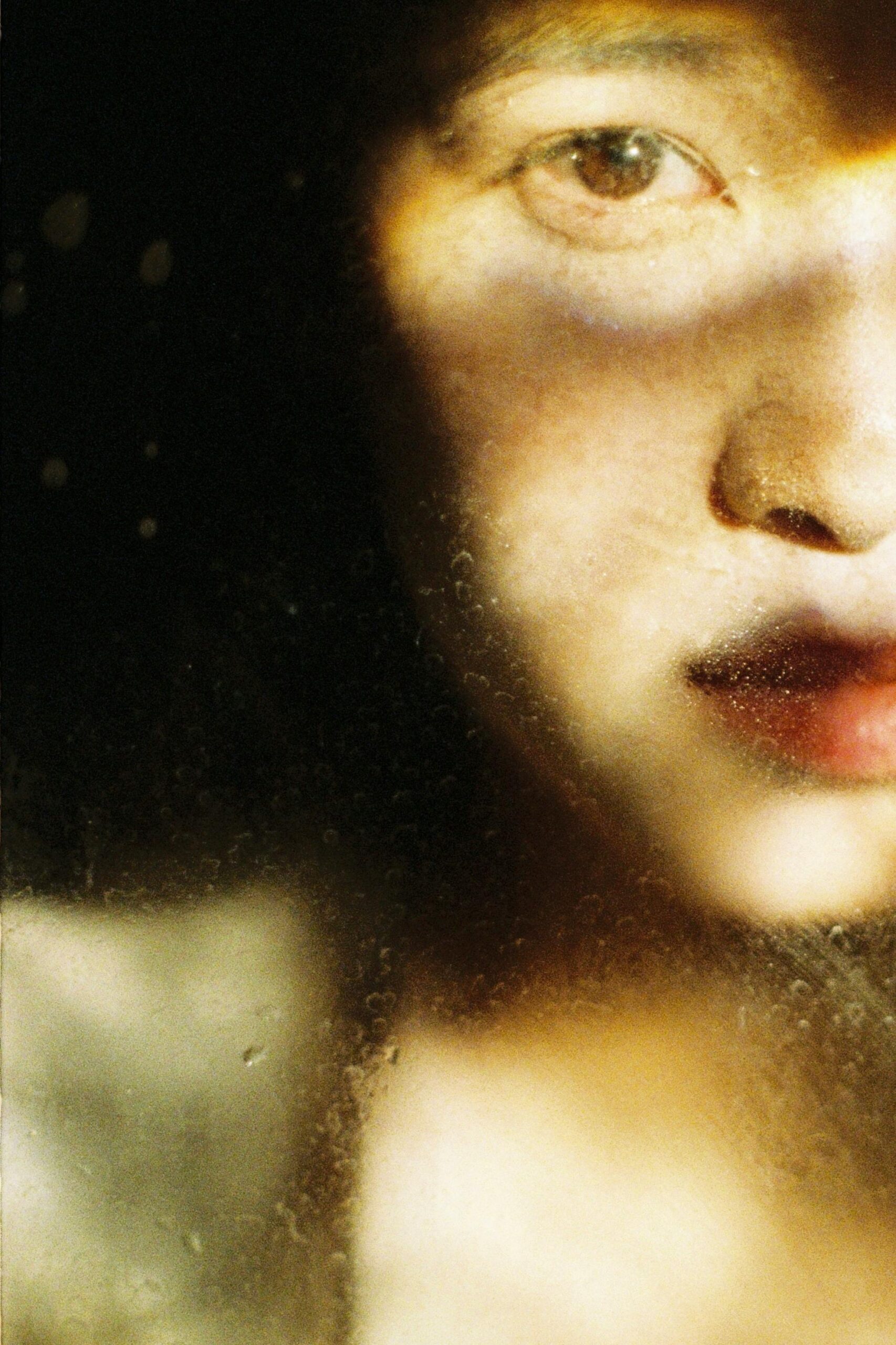 Bride adjusting her veil in soft window light—representing the often-overlooked website details Google evaluates when ranking wedding photographers online.