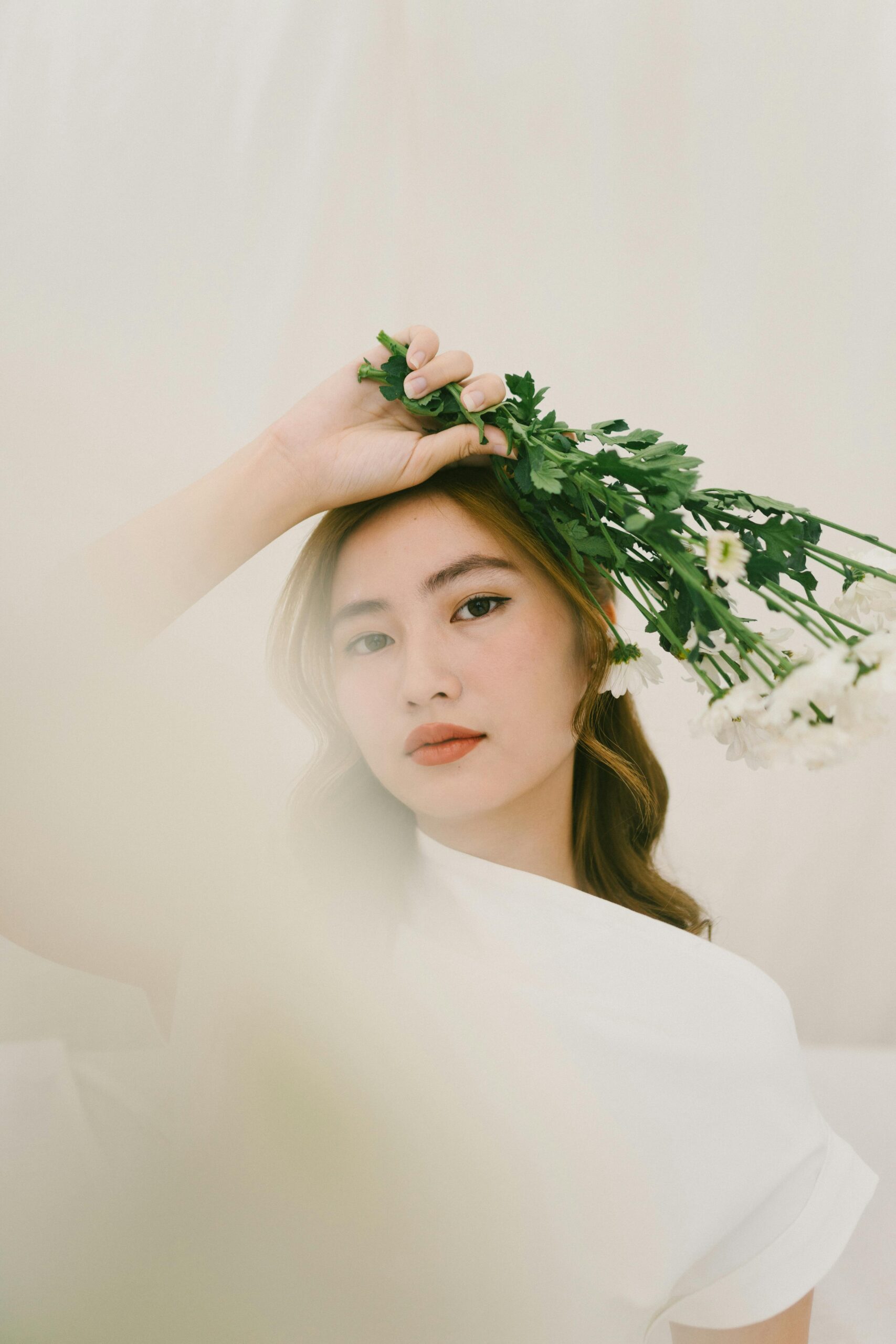 Wedding photographer reflecting at her desk with notes and a laptop—capturing the emotional and strategic reasons creatives choose to hire a marketing agency.