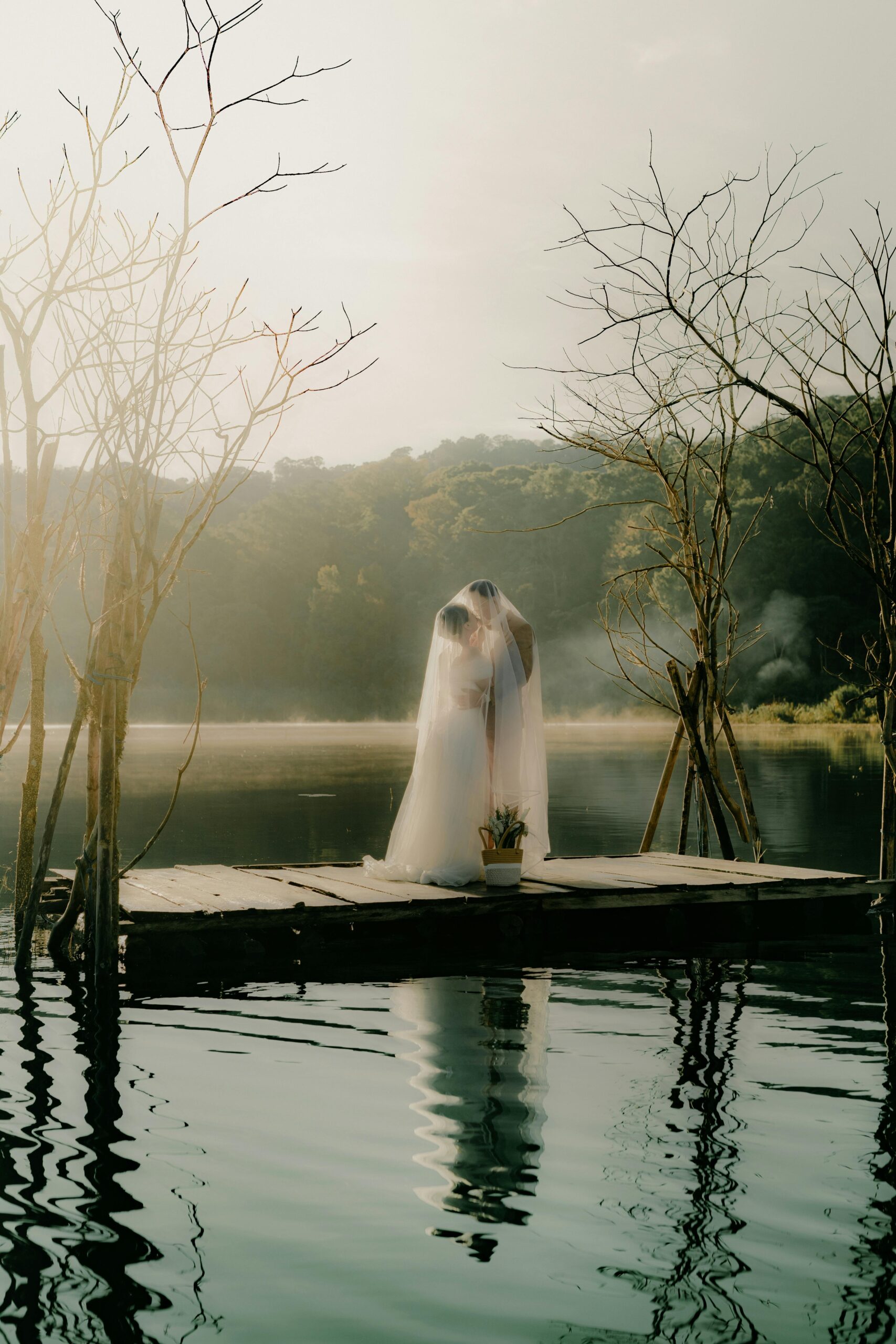 Wedding photographer working on laptop to improve SEO blog content and Pinterest strategy during the off-season