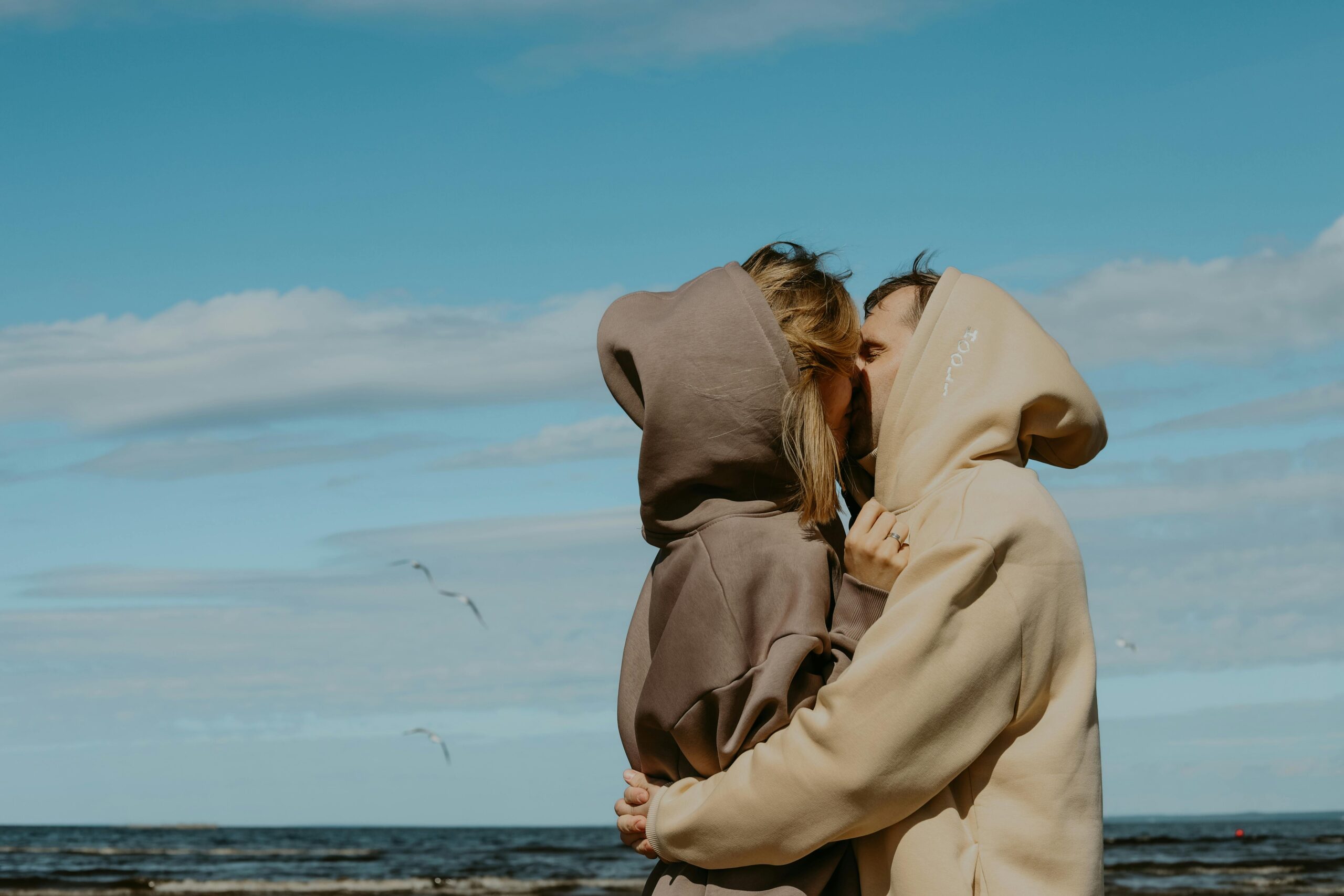 Luxury couple using a laptop to research wedding vendors with ChatGPT and Google AI tools