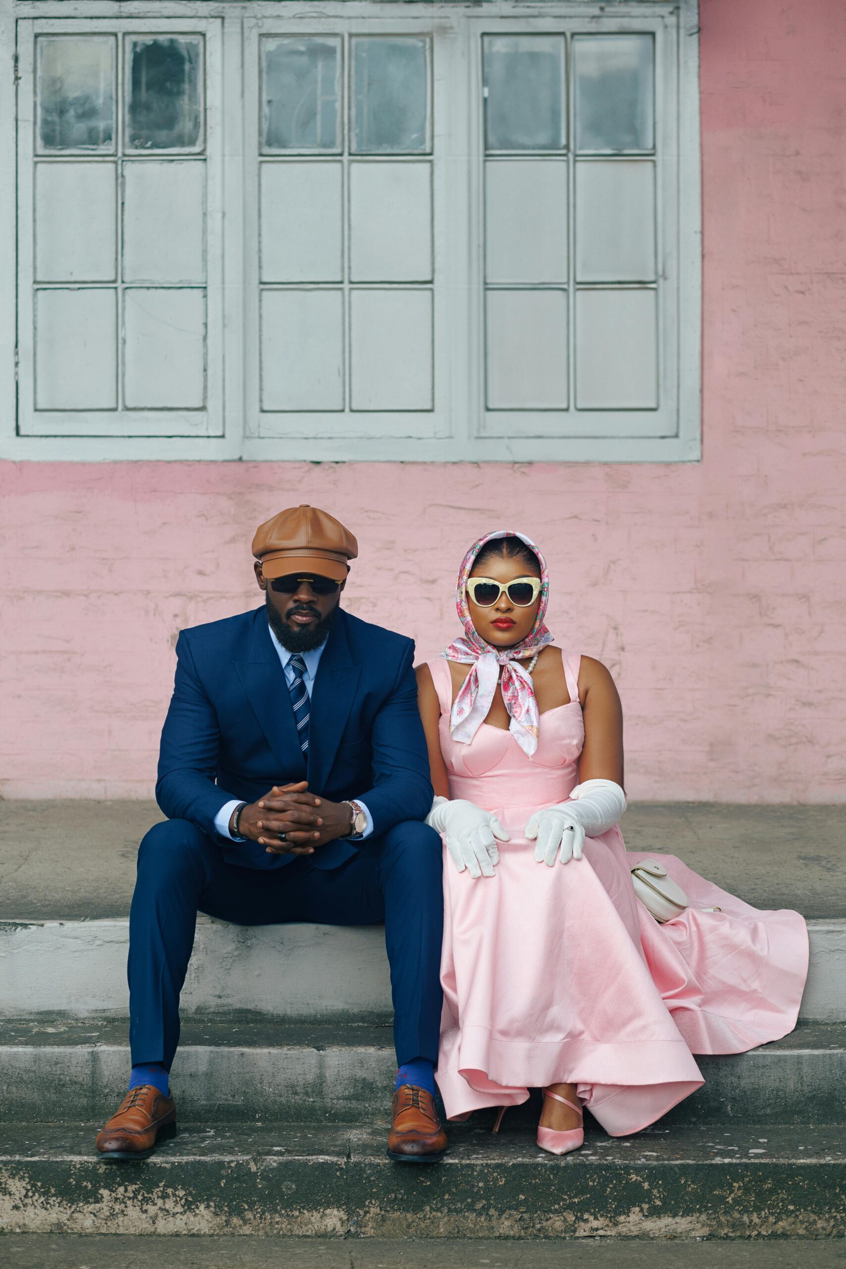 Blog header graphic with the text '10 Strategic Blog Topics for Wedding Planners to Boost AI Visibility' by North and South Agency, layered over a black-and-white city background with a romantic couple on a tablet screen in the foreground